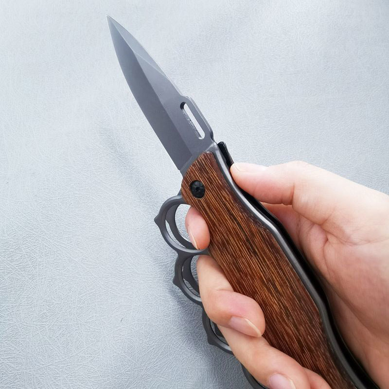 Couteau pliant poing américain manche en bois et manche en acier
